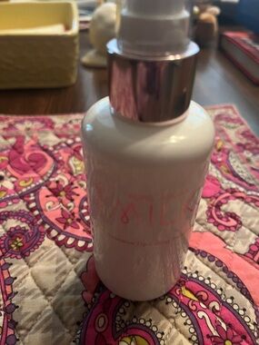 White Pump Bottle Skincare with Pink Accent by Josie Maran milk treatment